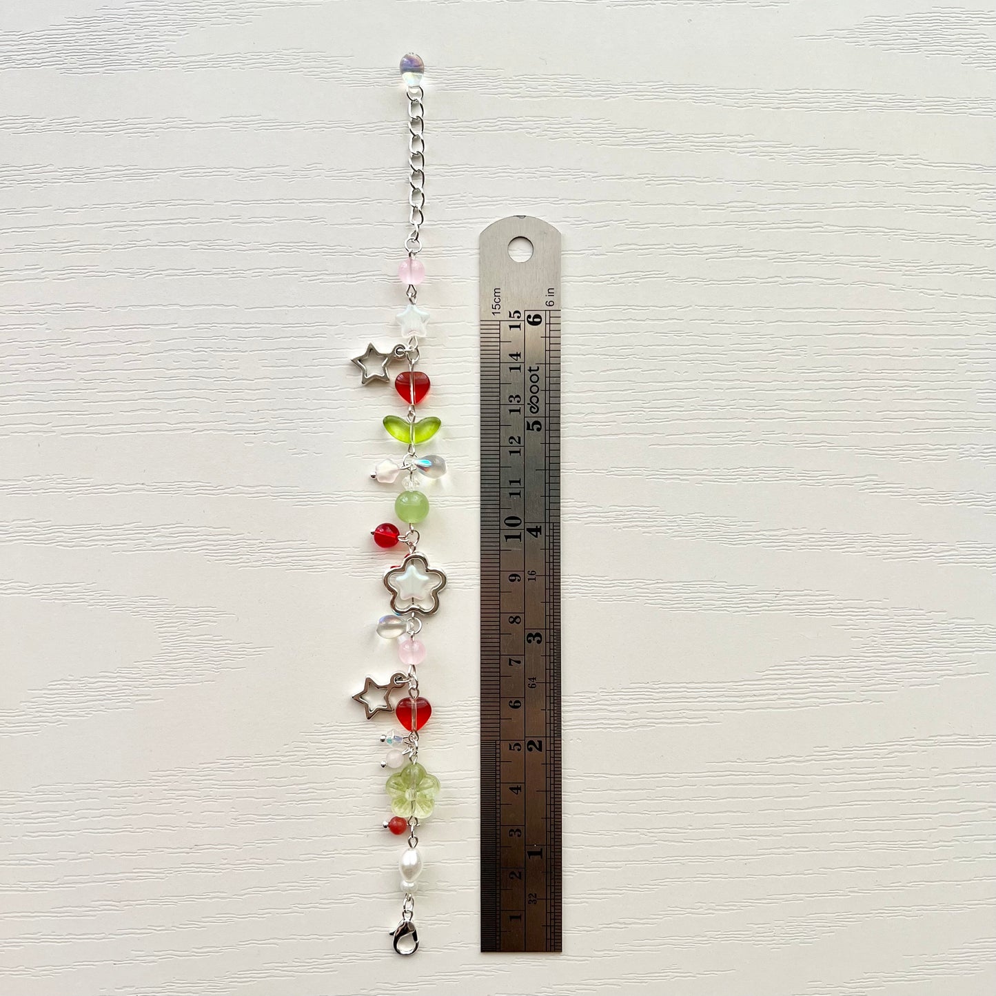 strawberry bracelet + phone charm